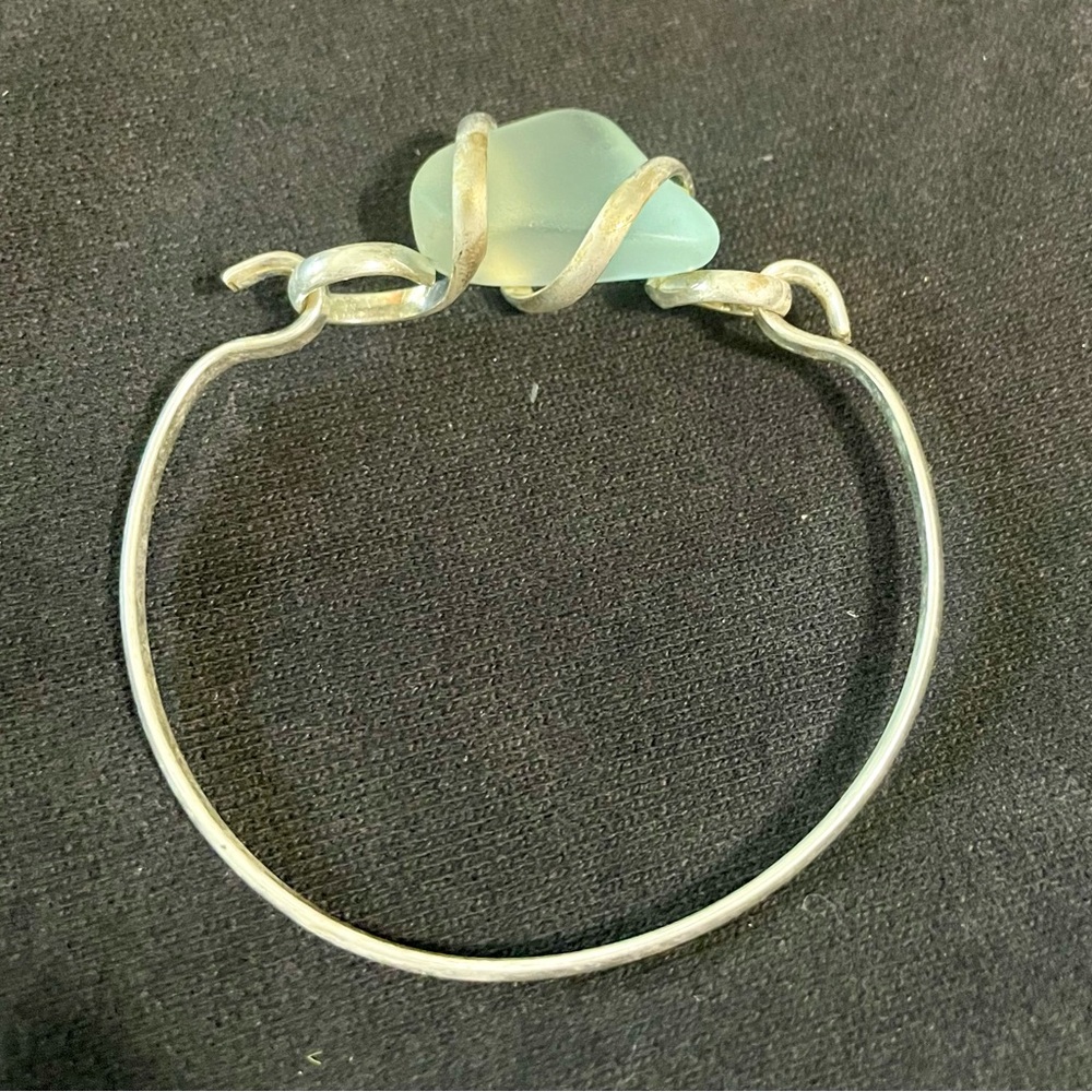 Silver plated bracelet with seafoam color glass. Bangle style new condition